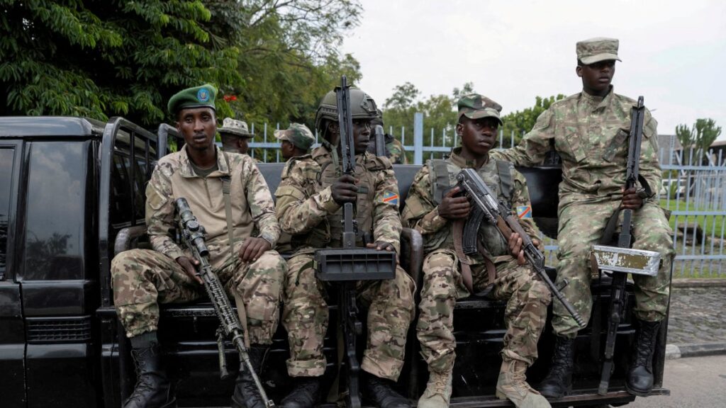M23 rebels sit on a truck during the escort of captured FDLR members to Rwanda for repatriation, at the Goma-Gisenyi Grande Barrier border crossing, March 1, 2025. (Reuters Photo)