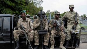 M23 rebels sit on a truck during the escort of captured FDLR members to Rwanda for repatriation, at the Goma-Gisenyi Grande Barrier border crossing, March 1, 2025. (Reuters Photo)