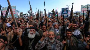 Yemenis brandish rifles and chant during a demonstration called for by the rebel Houthi movement in Sanaa, Yemen, March 17, 2025. (AFP Photo)