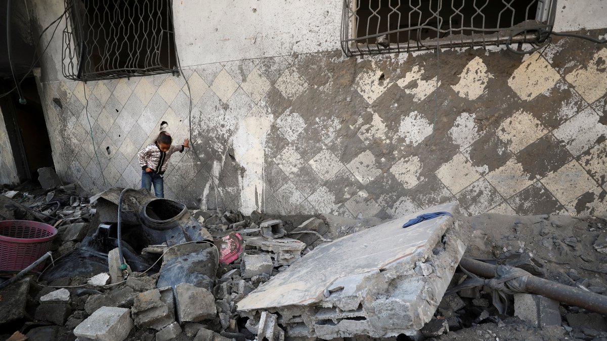 A Palestinian child stands at the site of an Israeli strike on a residential building in Jabalia in the northern Gaza Strip, Palestine, March 18, 2025. (Reuters Photo)