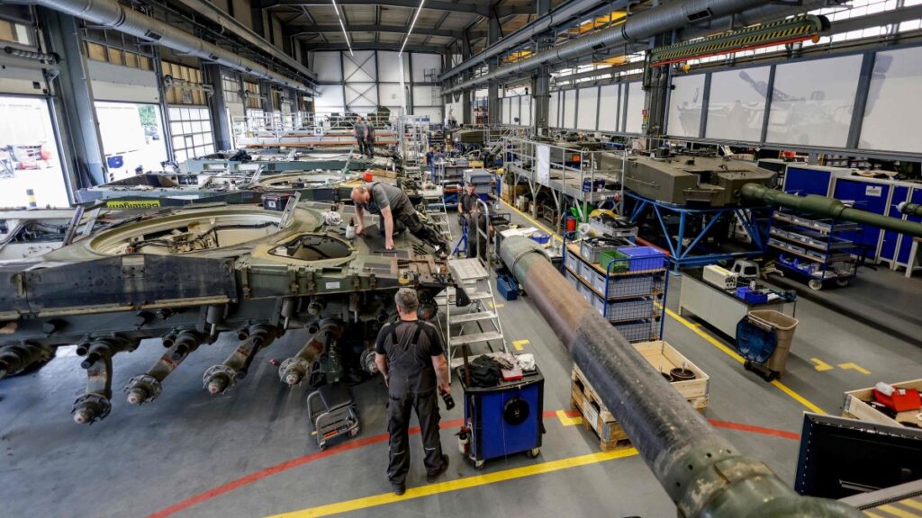 Technicians of German armaments company and automotive supplier Rheinmetall assemble a Leopard 2A4 battle tank in Unterluess, northern Germany, June 6, 2023. (AFP Photo)
