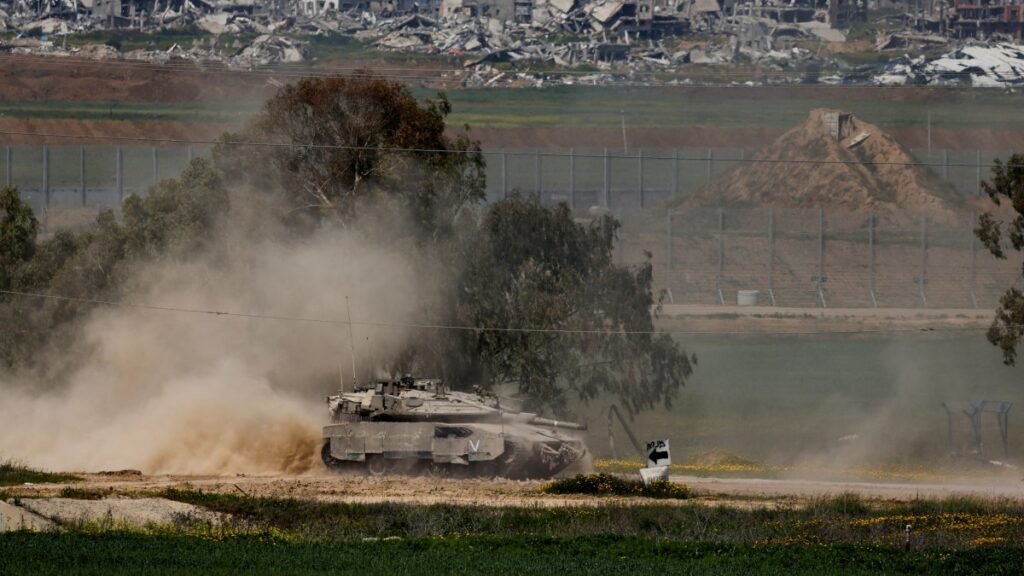 An Israeli tank manoeuvres on the Israeli side of the border between Israel and Gaza, March 18, 2025. (Reuters Photo)
