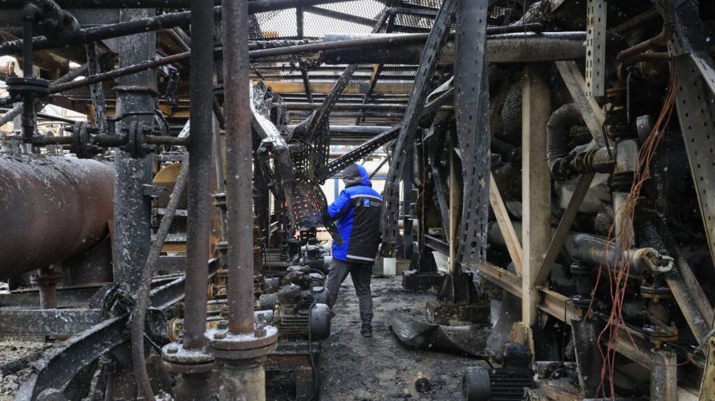 A worker inspects the damage at the AES Group private oil refinery the day after a Russian shock drone attack, in Merefa, Kharkiv region, Ukraine, March 18, 2025. (EPA Photo)