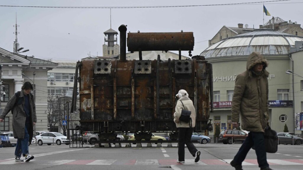 People walk past equipment retrieved from a Ukrainian power plant struck by Russian forces and put on display in the Podil neighborhood of Kyiv, Ukraine, March 19, 2025. (AFP Photo)
