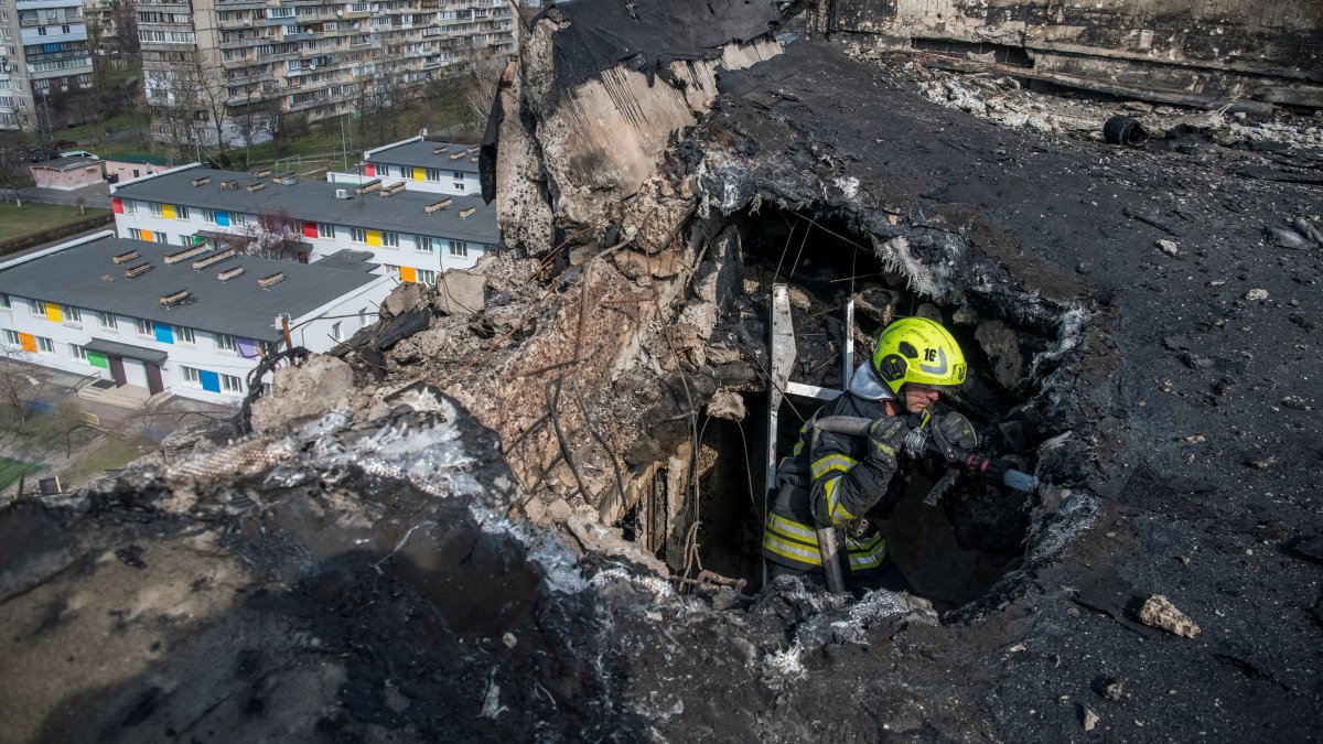 A firefighter works at a building hit by a Russian drone strike, in Kyiv, Ukraine, March 23, 2025. (Reuters Photo)