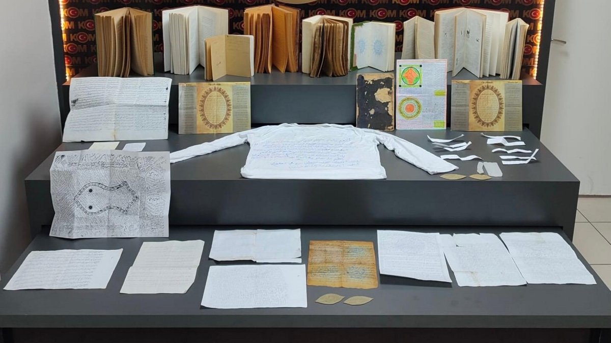 Notebooks, papers and books believed to be used for witchcraft are seized during searches of the suspects' homes, Batman, southeastern Türkiye, March 21, 2025. (AA Photo)