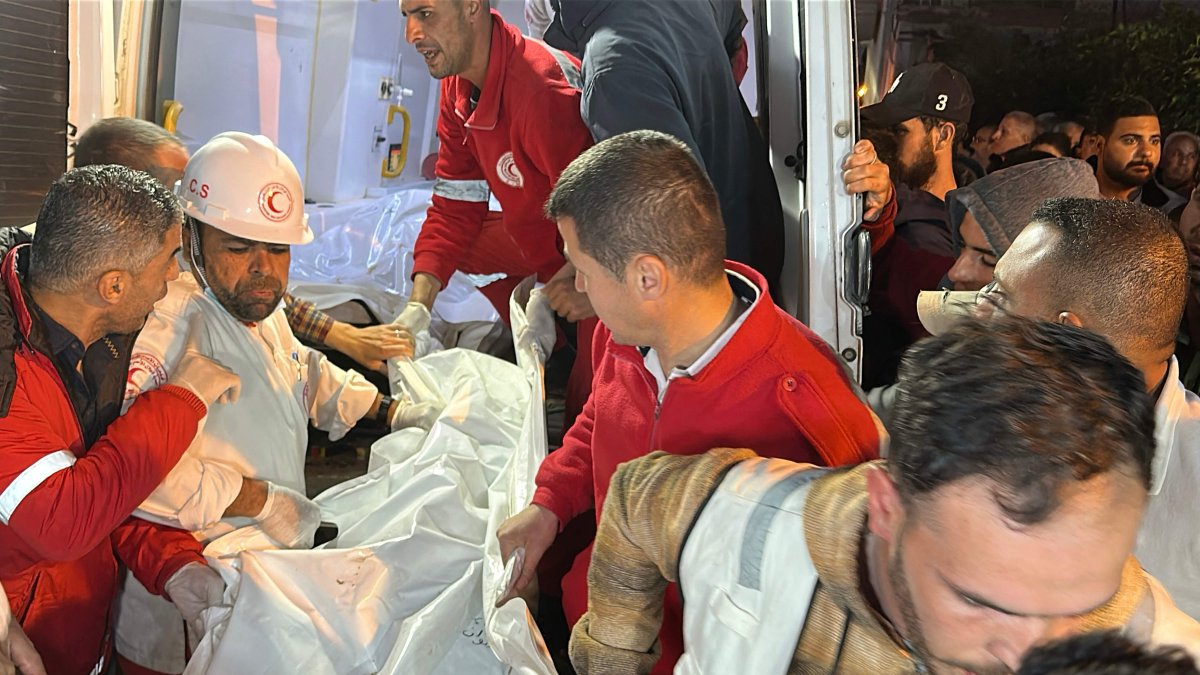 Paramedics transport out of an ambulance some of the bodies of Palestinian first responders, who were killed a week before in Israeli military fire on ambulances, into Nasser Medical Complex, Khan Younis, Gaza Strip, Palestine, March 30, 2025. (AFP Photo)