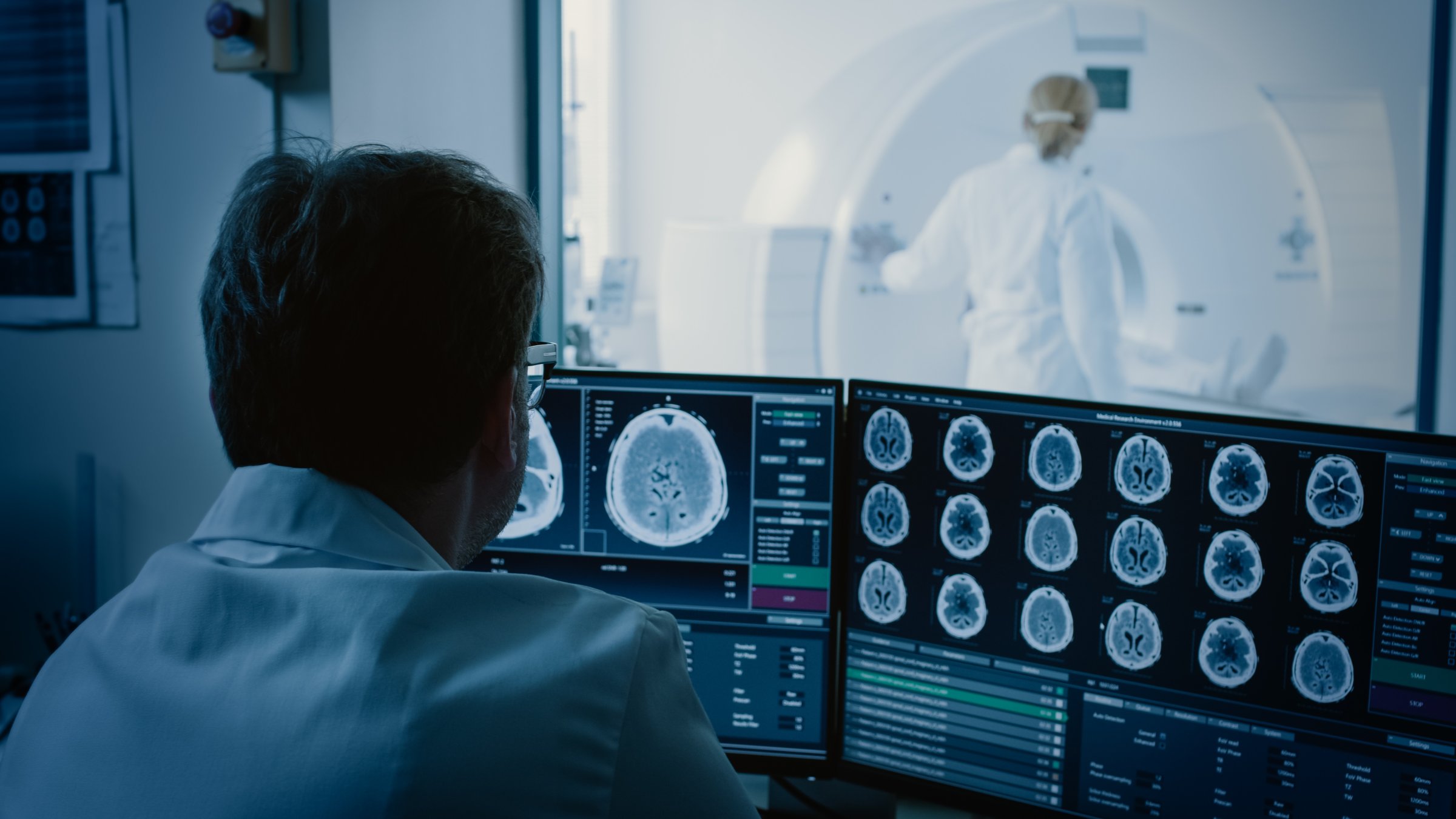A doctor examines a patient's MRI scan at a health center. (Shutterstock Photo)
