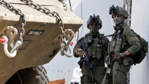 Israeli soldiers stand next to a military vehicle during an Israeli raid, Jenin, Palestine, March 4, 2025. (Reuters Photo)