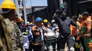 Emergency workers evacuate an injured person at the scene after the collapse of the Jet Set Club's roof in Santo Domingo, Dominican Republic, April 8, 2025. (EPA Photo)