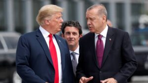 U.S. President Donald Trump and President Recep Tayyip Erdoğan gesture as they talk at the start of the NATO summit in Brussels, Belgium, July 11, 2018. (Reuters File Photo)