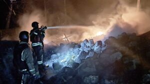 This handout photograph taken and released by Ukrainian State Emergency Service on March 28, 2025, shows firefighters manning a hose to put out a fire following a strike, Sumy region, Ukraine. (AFP Photo)