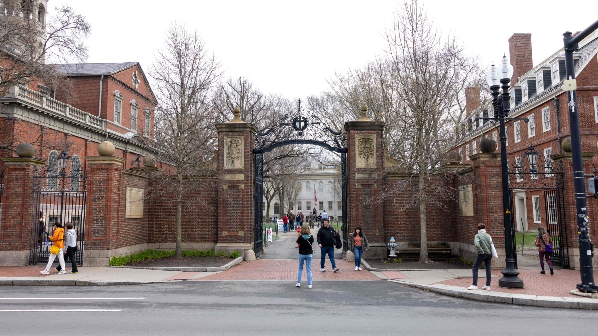 People in front of the main gate to Harvard Yard, in Cambridge, Massachusetts, U.S., April 15, 2025. (AFP Photo)