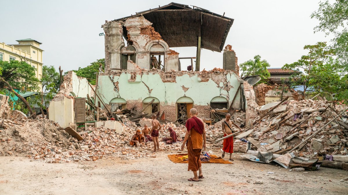 Buddhist monks dig through the rubble at a temple after a magnitude 7.7 earthquake struck Mandalay, in northern Myanmar, April 8, 2025. (AA Photo)