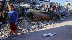 Displaced Palestinian children sit on an unexploded Israeli ordnance in Gaza City, central Gaza, Palestine, April 19, 2025. (AFP Photo)