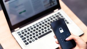 Phone password lock and passcode safeguard data privacy from cyber threats on mobile and laptop devices. (Shutterstock Photo)