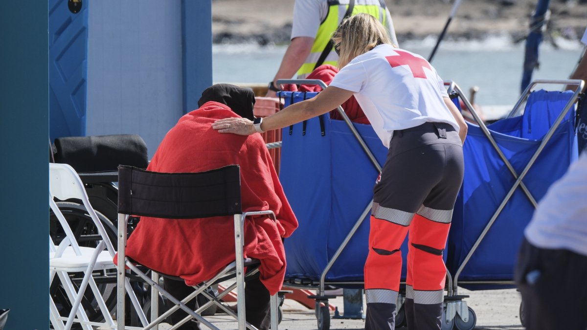A migrant receives assistance from a Red Cross volunteer in Tenerife, Canary Islands, Spain, April 11, 2025. (EPA Photo)