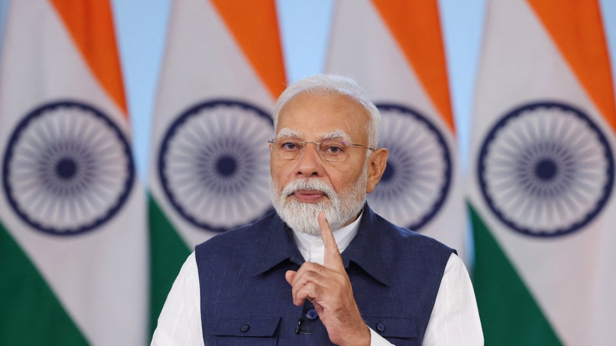 India's Prime Minister Narendra Modi addresses the "Rozgar Mela," an initiative aimed at creating jobs annually through regular recruitment drives across various government departments, via video conferencing in New Delhi, India, April 26, 2025. (India's Press Information Bureau/Handout via Reuters)