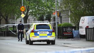 Police officers cordon off the scene after several people were killed in a shooting at Vaksala Square in central Uppsala, Sweden, April 29, 2025. (AFP Photo)