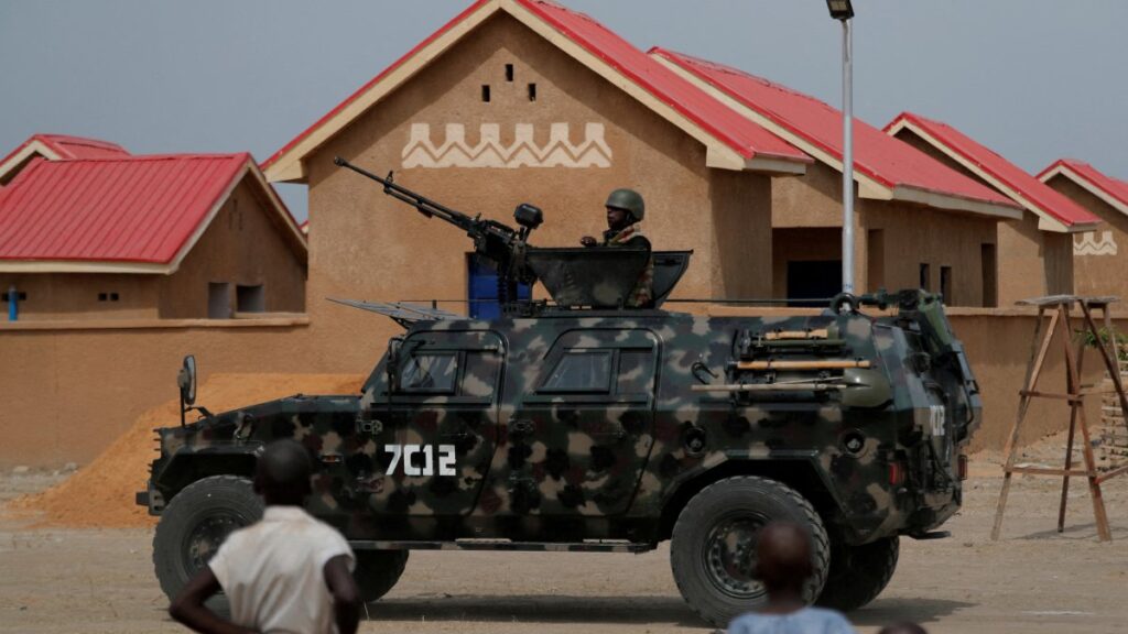 An armored vehicle of Nigerian Security Forces drives by newly built homes, ahead of the community re-opening ceremony which was destroyed by Boko Haram armed militants in 2015, in Ngarannam, Borno State, Nigeria, Oct. 21, 2022. (Reuters Photo)