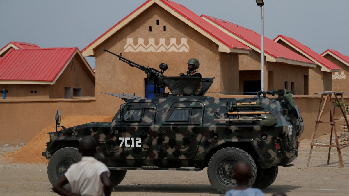An armored vehicle of Nigerian Security Forces drives by newly built homes, ahead of the community re-opening ceremony which was destroyed by Boko Haram armed militants in 2015, in Ngarannam, Borno State, Nigeria, Oct. 21, 2022. (Reuters Photo)