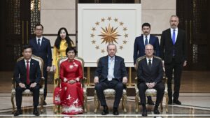 President Recep Tayyip Erdoğan (front 2nd R) takes a souvenir photo with Vietnamese Ambassador Dang Thi Thu Ha (front 2nd L) and her embassy staff and family members at the Presidential Complex, the capital Ankara, Türkiye, May 1, 2025. (AA Photo)