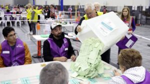 Officials count ballots in the general election at a polling station in Melbourne, Australia, May 3, 2025. (AFP Photo)