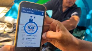 A migrant shows the CBP One App from the U.S. Customs and Border Protection agency, to use to apply for an appointment to claim asylum, on a phone in Ciudad Juarez, Chihuahua state, Mexico, May 10, 2023. (AFP Photo)