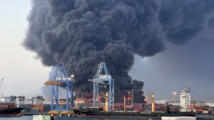 A column of smoke rises after a seaport was targeted by drone strikes carried out by RSF paramilitaries, Port Sudan, Sudan, May 6, 2025. (AA Photo)