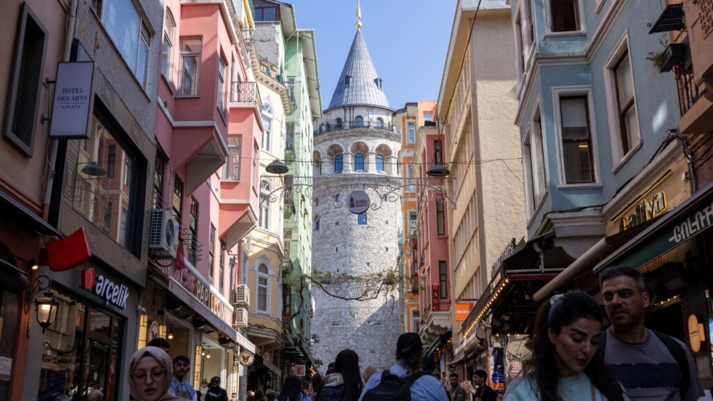 People walk on a small street that leads to the historical Galata Tower in Istanbul, Türkiye, April 25, 2025. (Reuters Photo)