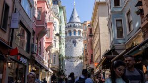 People walk on a small street that leads to the historical Galata Tower in Istanbul, Türkiye, April 25, 2025. (Reuters Photo)