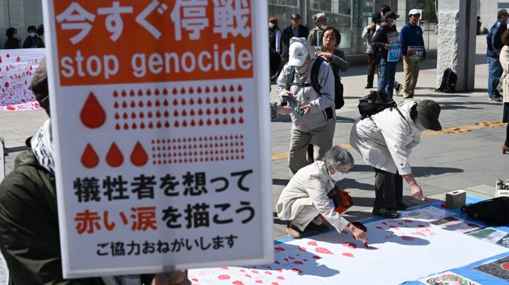 People draw red tear drops for Palestinians in Sapporo, Hokkaido Prefecture, Japan, April 7, 2024. (Reuters Photo)