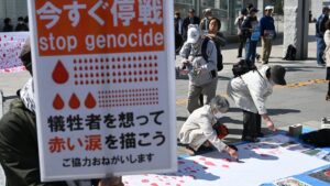 People draw red tear drops for Palestinians in Sapporo, Hokkaido Prefecture, Japan, April 7, 2024. (Reuters Photo)