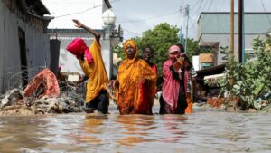 A Somali family wades through flood waters, as they flee after overnight rains destroyed their home, in Wadajir district, Mogadishu, Somalia, May 10, 2025. (Reuters Photo)