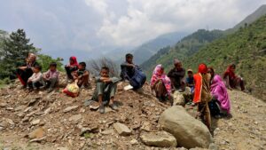 People evacuated from their homes near the Line of Control (LoC) between India and Pakistan following cross-border shelling, wait as authorities stopped them from returning to their villages, Gantamulla, India-ruled Kashmir, May 11, 2025. (Reuters Photo)