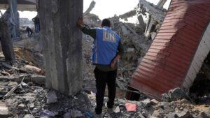 A U.N. worker stands amid the rubble of an UNRWA school-turned-shelter destroyed in an overnight Israeli strike in Jabalia, northern Gaza Strip, Palestine, on May 10, 2025. (AFP Photo)