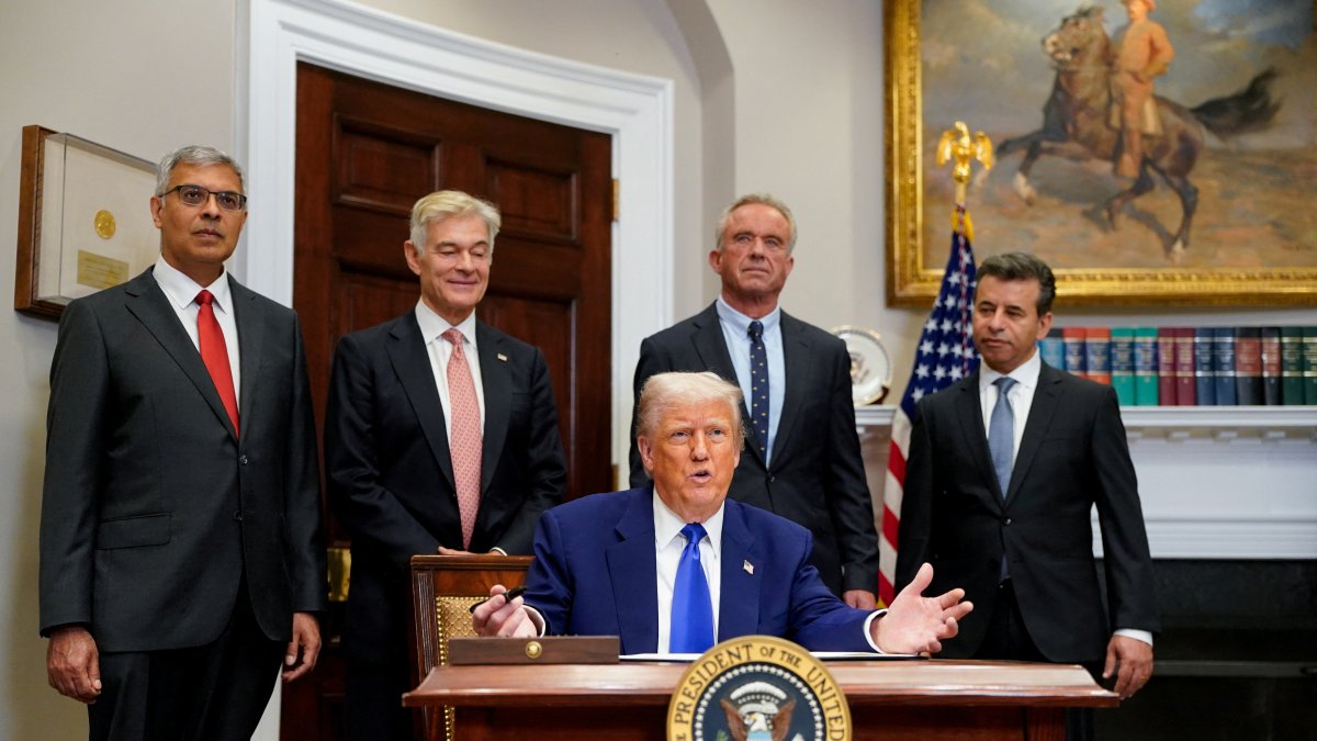 U.S. President Donald Trump gestures on the day he signs an executive order on prescription drug pricing, next to U.S. Health and Human Services (HHS) Secretary Robert F. Kennedy, Jr., during a press conference in the Roosevelt Room at the White House in Washington, D.C., U.S., May 12, 2025. (Reuters Photo)