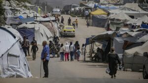 Internally displaced Palestinians move between tents along Al Jalaa road in the central of Gaza City, Gaza Strip, May 16, 2025. (EPA Photo)