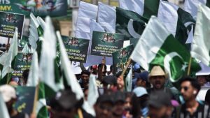 Pakistani university students hold placards and wave national flags during a rally to show solidarity with the Pakistani armed forces, in Karachi, Pakistan, May 15, 2025. (EPA Photo)