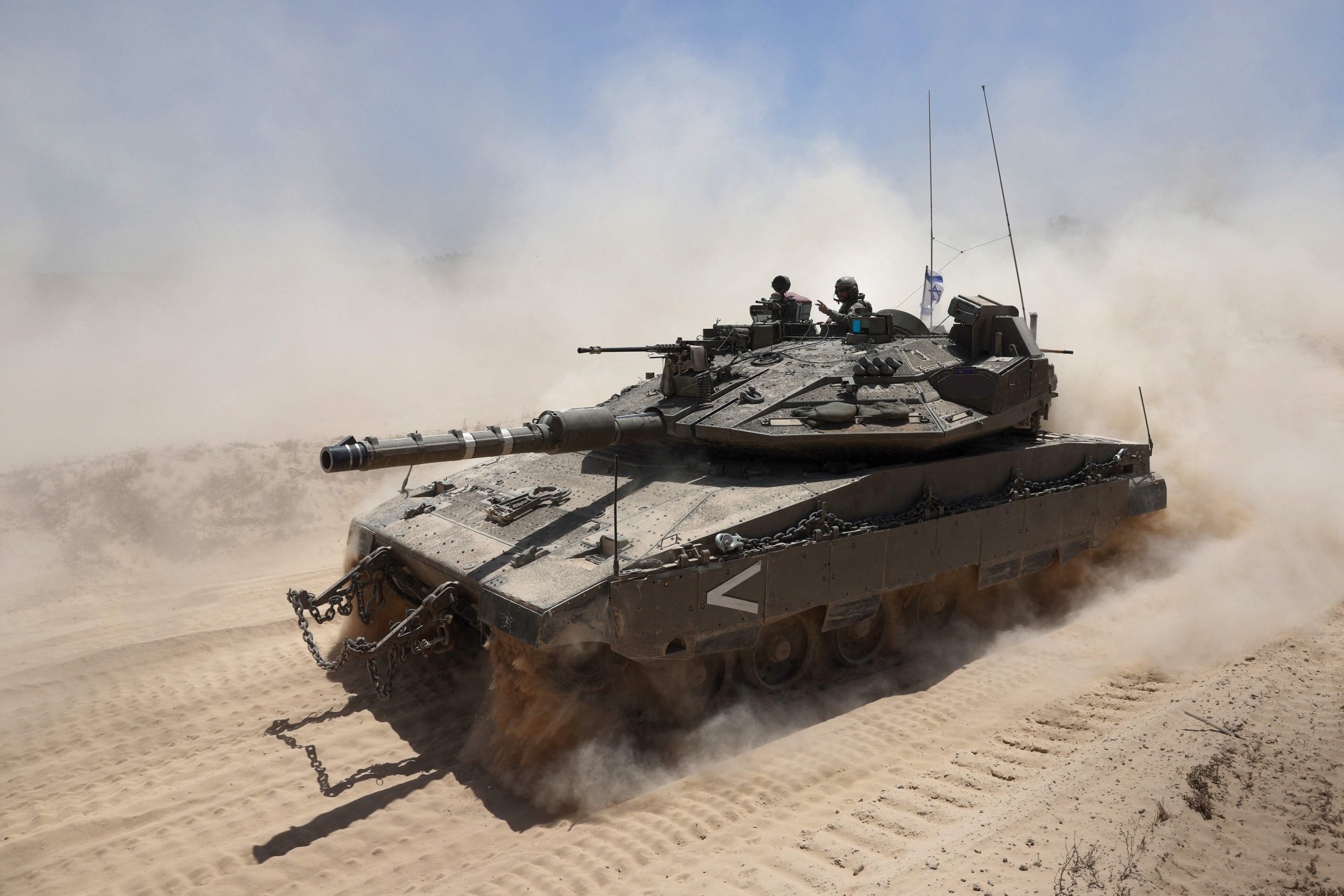 383177 An Israeli soldier gestures atop a military vehicle at Israel's southern border with the Gaza Strip, May 20, 2025. (AFP Photo)