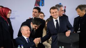 President Recep Tayyip Erdoğan shakes hands with French President Emmanuel Macron ahead of a summit on defense and security with leaders of the EU, Tirana, Albania, May 16, 2025. (AP Photo)