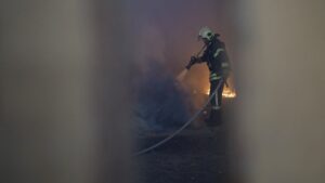 A Ukrainian emergency worker puts out a fire at the site of a Russian missile strike in Sumy, Ukraine, May 21, 2025. (AA Photo)