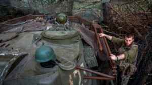 A Ukrainian serviceman climbs down from a self-propelled howitzer as he prepares to fire toward Russian troops, in Donetsk region, Ukraine, May 15, 2025. (Reuters Photo)