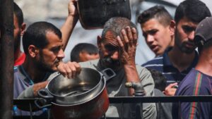 Palestinians react after the food ran out at a charity kitchen they queue at for a hot meal in Jabalia in the northern Gaza Strip, Palestine, May 17, 2025. (AFP Photo)