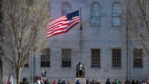 Demonstrators with signs stand around the John Harvard Statue in Harvard Yard following a rally against President Donald Trump’s attacks on Harvard University at Harvard University in Cambridge, Massachusetts, April 17, 2025. (AFP Photo)