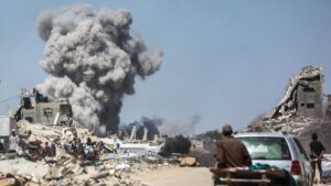 People watch as smoke billows following an Israeli strike in Jabalia, Gaza Strip, Palestine, May 25, 2025. (AFP Photo)