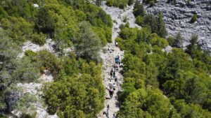 Hikers explore the restored ancient caravan and migration route winding through the natural landscape of Akseki district, Antalya, Türkiye, May 28, 2025. (AA Photo)