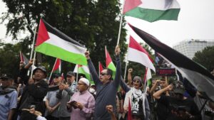 Indonesians wave Palestinian flags during the annual Al-Quds Day rally outside the U.S. embassy in Jakarta, Indonesia, March 28, 2025. (AP Photo)