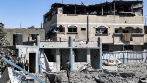 People search through rubble following Israeli bombardment in the Bureij camp for Palestinian refugees in the central Gaza Strip on May 23, 2025. (AFP Photo)