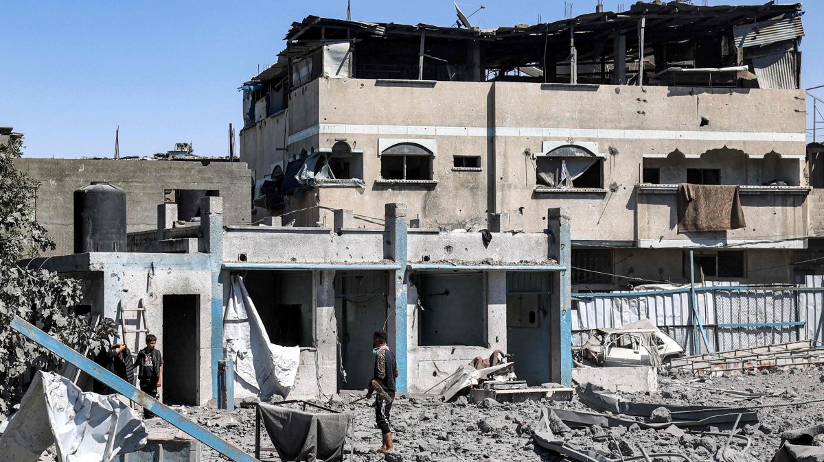 People search through rubble following Israeli bombardment in the Bureij camp for Palestinian refugees in the central Gaza Strip on May 23, 2025. (AFP Photo)